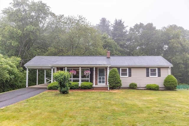 59 Mountain Rd, Holyoke, MA 01040 - ranch-style home with a front lawn, asphalt driveway, and a carport