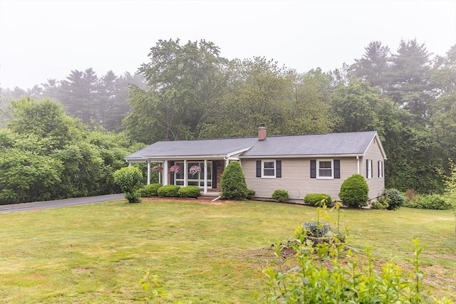 59 Mountain Rd, Holyoke, MA 01040 - ranch-style home with a front lawn and a chimney