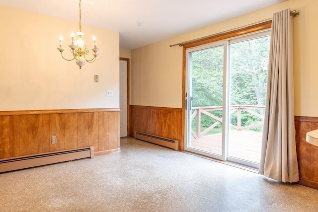 59 Mountain Rd, Holyoke, MA 01040 - empty room with a baseboard heating unit, a wainscoted wall, a chandelier, plenty of natural light, and wood walls