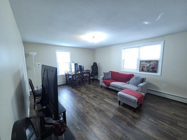 2018-2020 Prospect St, Palmer, MA 01080 - living room featuring dark wood-style flooring, a textured ceiling, and a baseboard radiator