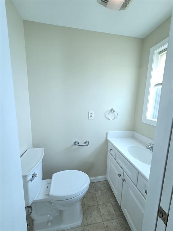 2018-2020 Prospect St, Palmer, MA 01080 - bathroom with toilet, vanity, baseboards, and tile patterned flooring