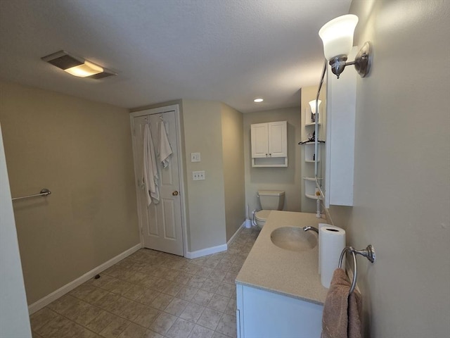 2018-2020 Prospect St, Palmer, MA 01080 - bathroom with baseboards, vanity, toilet, and recessed lighting