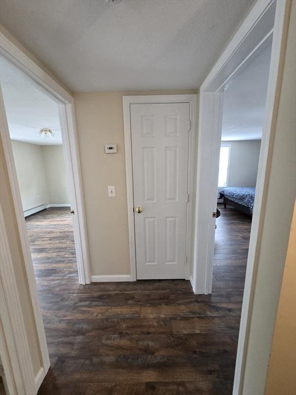 2018-2020 Prospect St, Palmer, MA 01080 - corridor with dark wood finished floors, baseboards, and a baseboard radiator