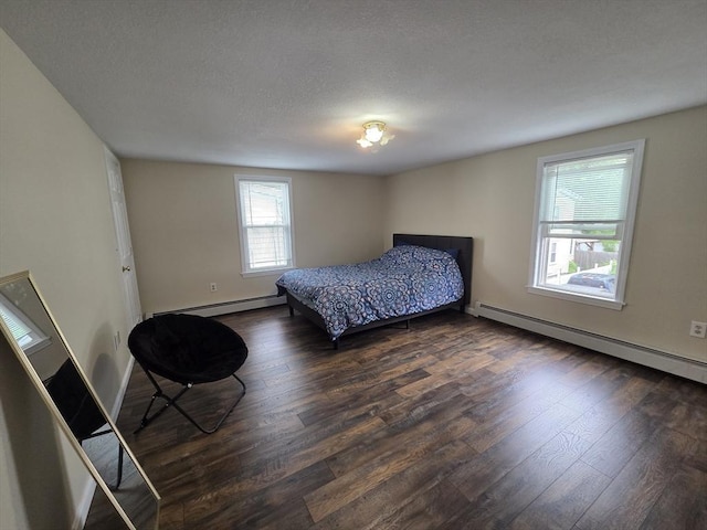 2018-2020 Prospect St, Palmer, MA 01080 - bedroom with baseboard heating, dark wood finished floors, and baseboards