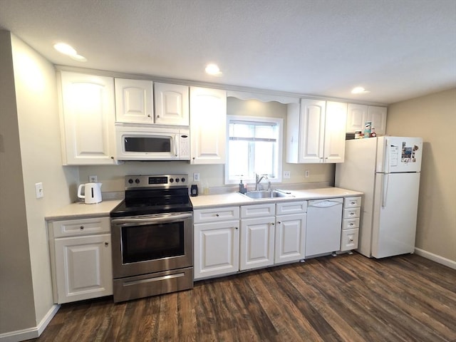 2018-2020 Prospect St, Palmer, MA 01080 - kitchen featuring white appliances, a sink, dark wood-type flooring, white cabinetry, and recessed lighting
