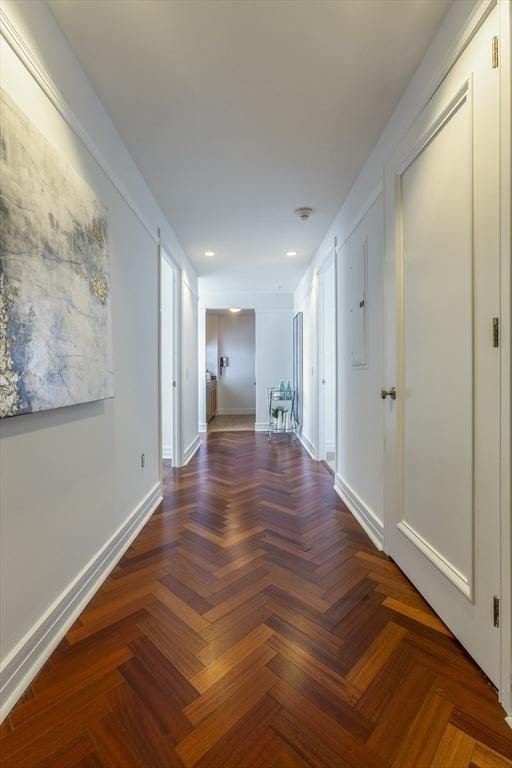 hallway with dark parquet floors