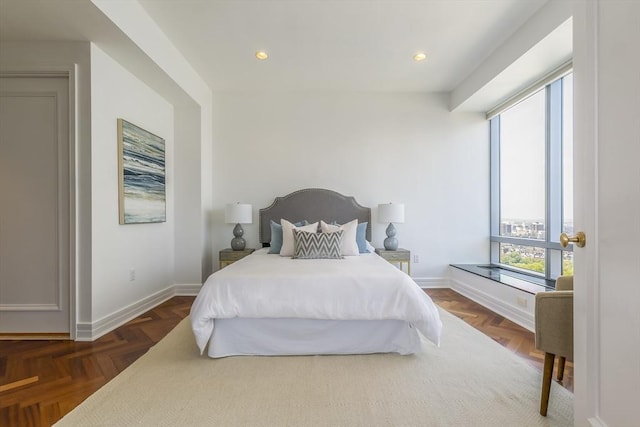 bedroom with dark parquet flooring