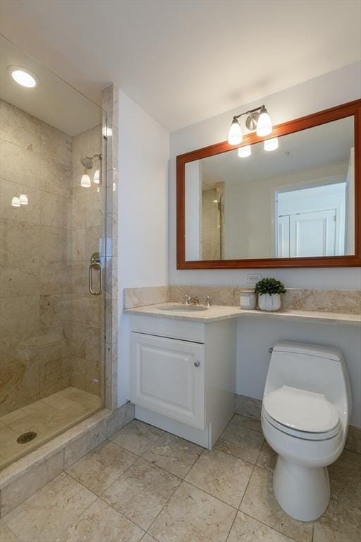 bathroom featuring vanity, toilet, and walk in shower