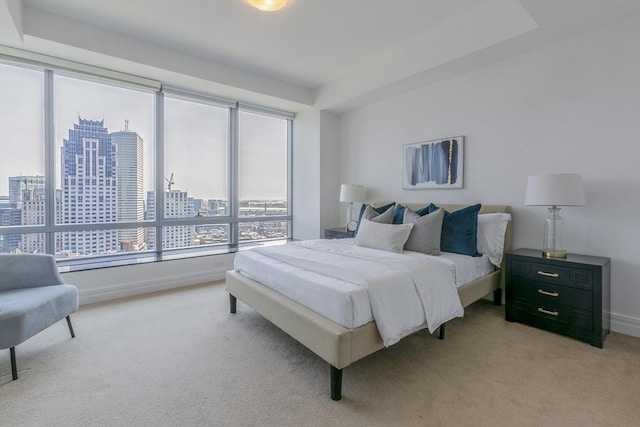 bedroom featuring light colored carpet