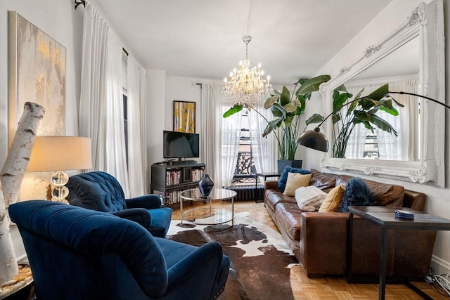 living area with plenty of natural light and a chandelier