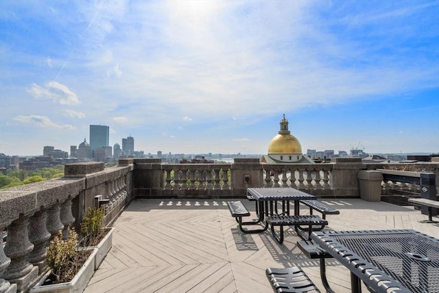 wooden deck with a view of skyline