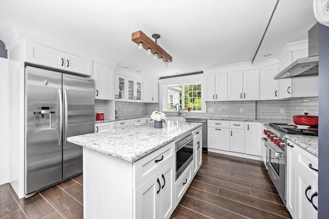 685 Highland St, Marshfield, MA 02050 - kitchen with appliances with stainless steel finishes, dark wood finished floors, white cabinets, and tasteful backsplash