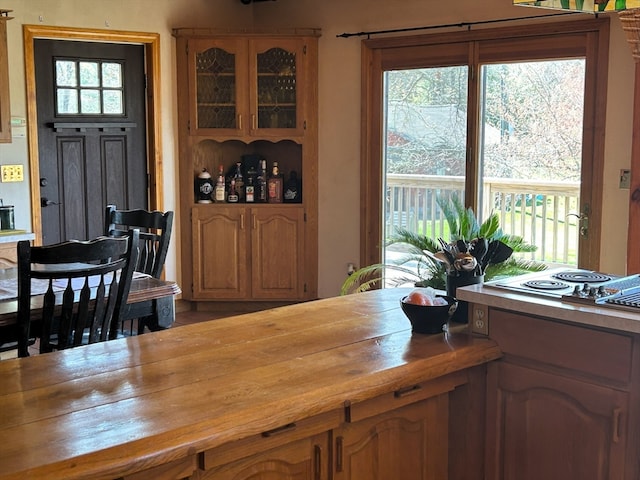 kitchen with electric stovetop and butcher block counters