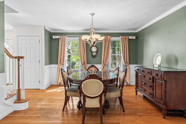 dining room with an inviting chandelier, light wood-style floors, and plenty of natural light