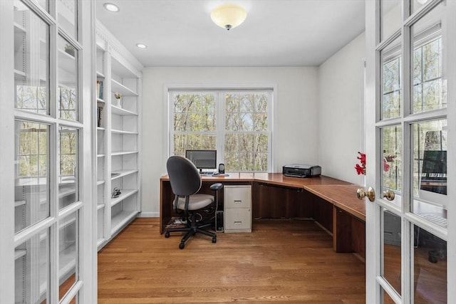 home office featuring recessed lighting, french doors, and light wood finished floors