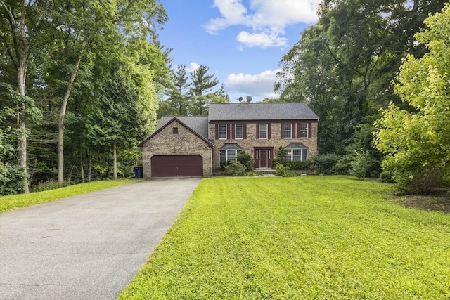 63 Forge Rd, Sharon, MA 02067 - colonial home with driveway, a garage, a front lawn, and stone siding