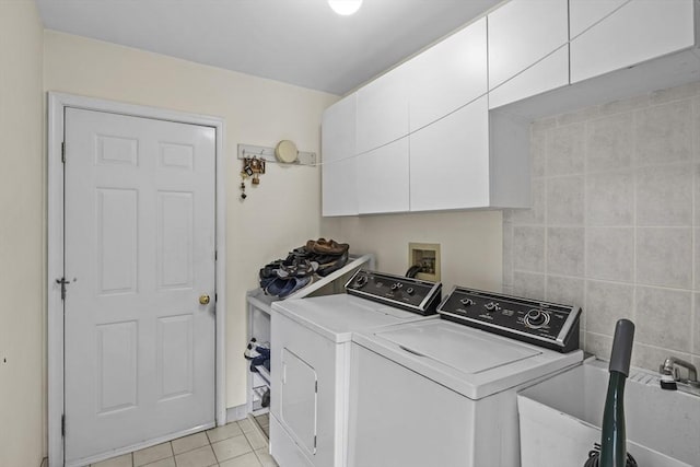 63 Forge Rd, Sharon, MA 02067 - washroom featuring cabinet space, washer and dryer, and light tile patterned floors