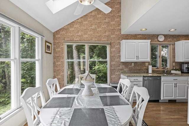 63 Forge Rd, Sharon, MA 02067 - dining space featuring lofted ceiling, healthy amount of natural light, a skylight, ceiling fan, and dark wood-style flooring