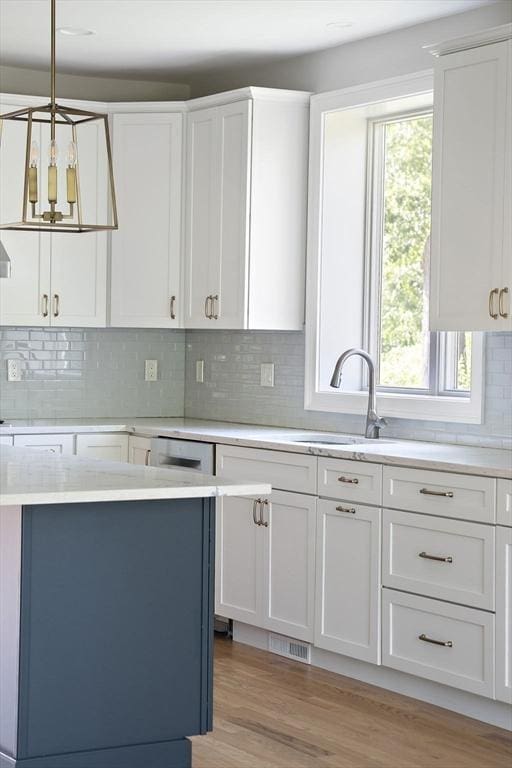 16 Pine Hill Rd Unit 16, Wenham, MA 01984 - kitchen with light countertops, white cabinets, and tasteful backsplash