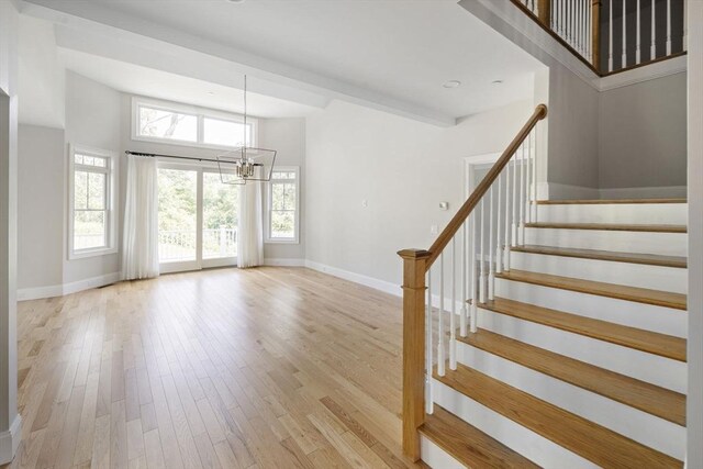 16 Pine Hill Rd Unit 16, Wenham, MA 01984 - staircase featuring a chandelier and wood finished floors