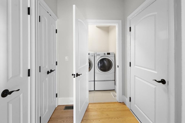 16 Pine Hill Rd Unit 16, Wenham, MA 01984 - washroom with separate washer and dryer and light wood-style flooring