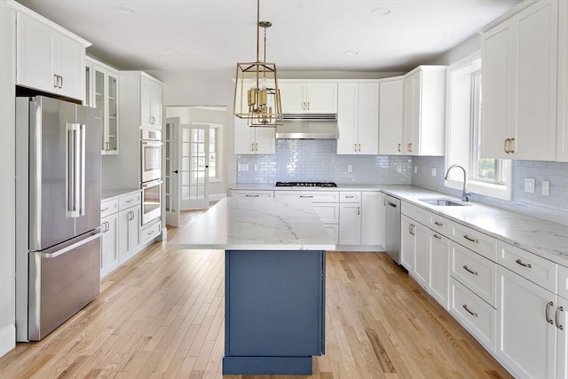 16 Pine Hill Rd Unit 16, Wenham, MA 01984 - kitchen with stainless steel appliances, under cabinet range hood, light wood-style floors, white cabinets, and recessed lighting