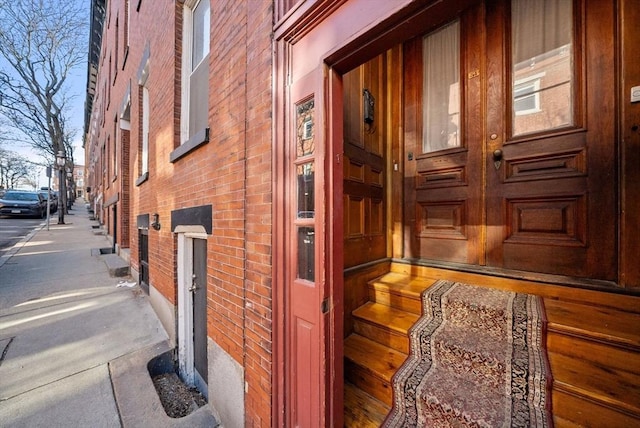 exterior space featuring brick siding