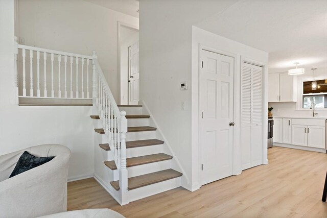stairs with wood finished floors