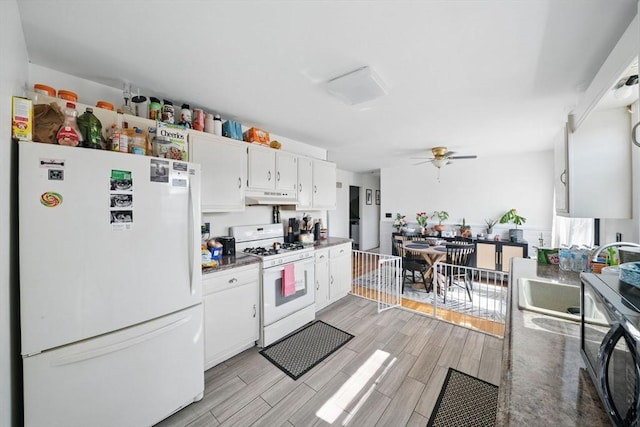 kitchen with white cabinets, white appliances, ceiling fan, under cabinet range hood, and wood finish floors