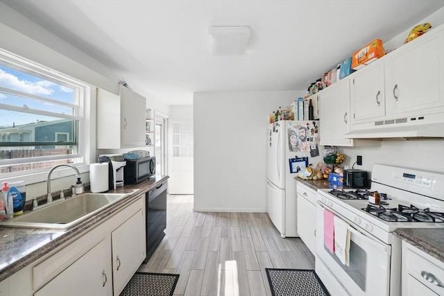 kitchen with white cabinetry, a sink, under cabinet range hood, and black appliances