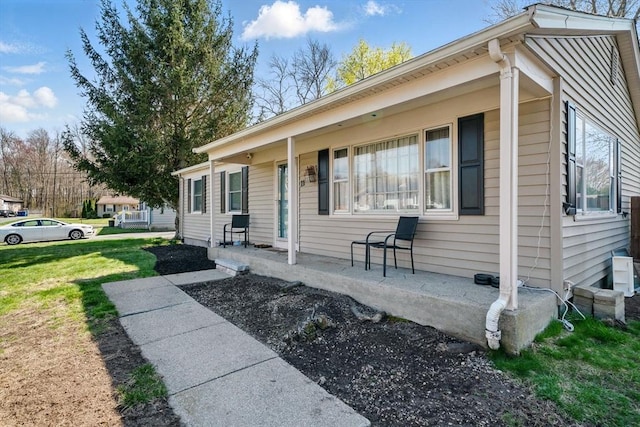 exterior space featuring a porch and a front lawn