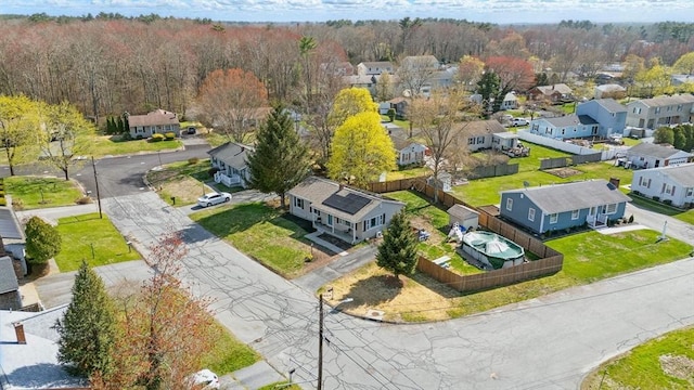 aerial view with a residential view and a view of trees