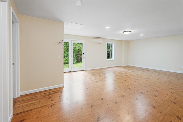 50 Maggie Ln, Southbridge, MA 01550 - empty room featuring a wall mounted air conditioner, light wood finished floors, a smoke detector, baseboards, and recessed lighting