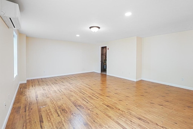 50 Maggie Ln, Southbridge, MA 01550 - spare room featuring a wall mounted air conditioner, light wood finished floors, baseboards, and recessed lighting