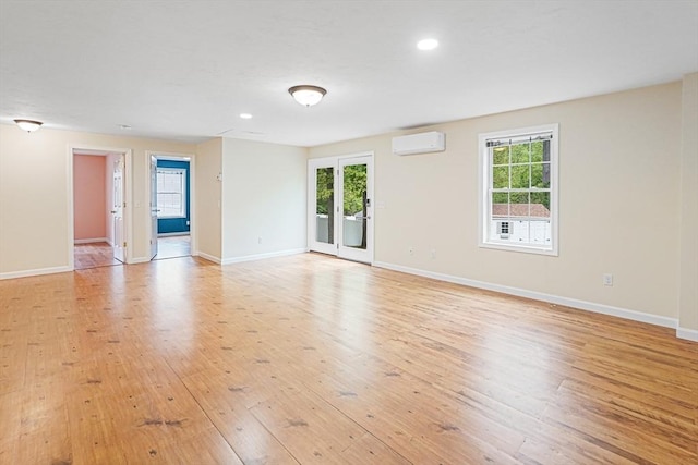 50 Maggie Ln, Southbridge, MA 01550 - spare room with a wall mounted AC, light wood-style flooring, baseboards, and recessed lighting