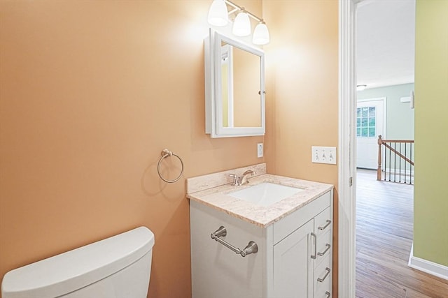 50 Maggie Ln, Southbridge, MA 01550 - half bath with vanity, wood finished floors, and toilet