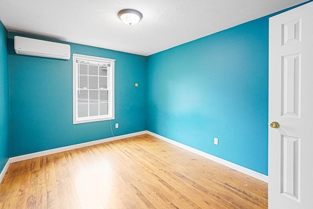 50 Maggie Ln, Southbridge, MA 01550 - empty room with a wall mounted AC, wood finished floors, and baseboards