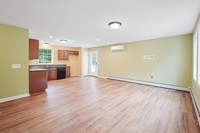 50 Maggie Ln, Southbridge, MA 01550 - unfurnished living room with a wall mounted AC, light wood-type flooring, baseboards, and recessed lighting