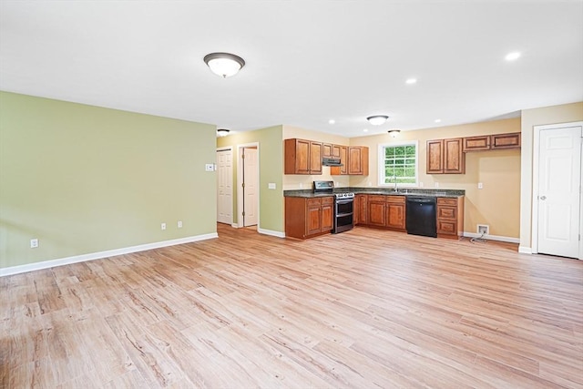 50 Maggie Ln, Southbridge, MA 01550 - kitchen featuring range with two ovens, black dishwasher, dark countertops, brown cabinets, and light wood-type flooring