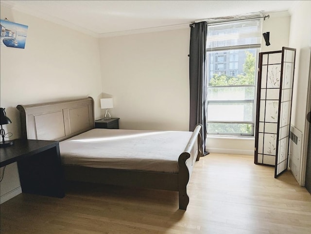99 Pond Ave Unit 608, Brookline, MA 02445 - bedroom with ornamental molding and light wood finished floors