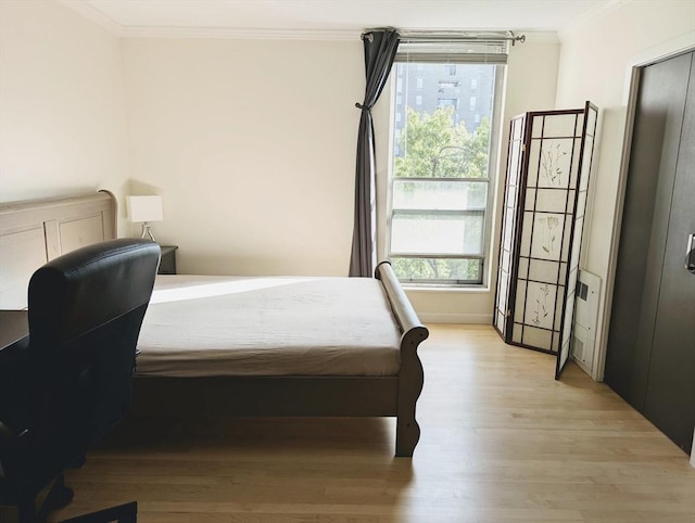 99 Pond Ave Unit 608, Brookline, MA 02445 - bedroom featuring crown molding, light wood-style floors, and baseboards
