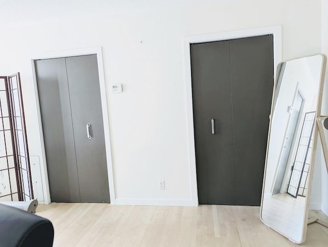 99 Pond Ave Unit 608, Brookline, MA 02445 - bedroom with wood finished floors and baseboards