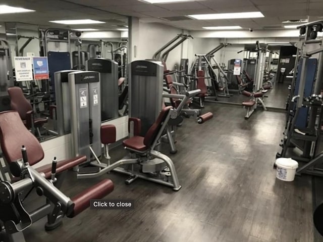 99 Pond Ave Unit 608, Brookline, MA 02445 - workout area with a drop ceiling and wood finished floors