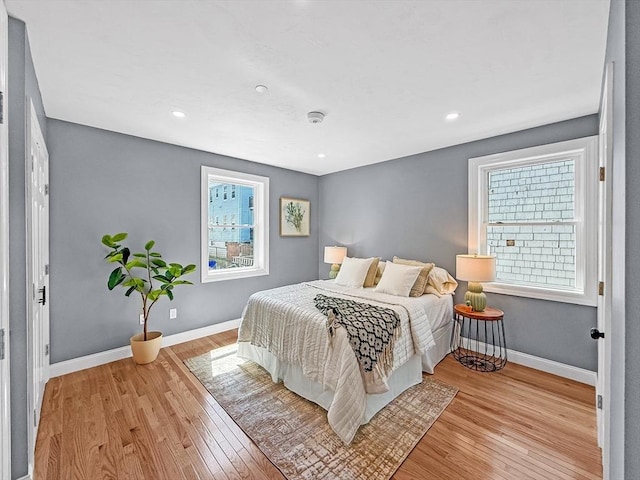 bedroom featuring light wood-style floors, baseboards, and recessed lighting