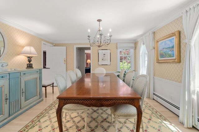 dining room featuring crown molding, a baseboard radiator, a notable chandelier, and wallpapered walls