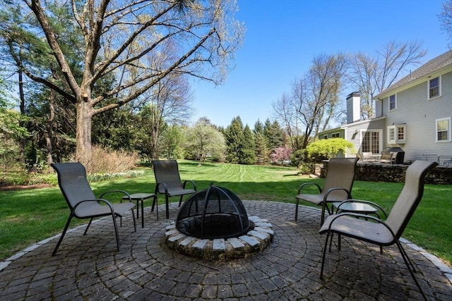 view of patio / terrace featuring a fire pit