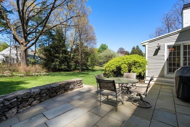 view of patio featuring a grill and outdoor dining space