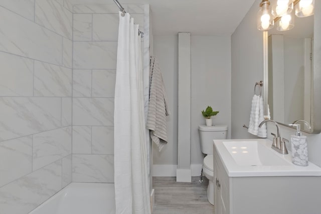 full bathroom featuring hardwood / wood-style flooring, vanity, toilet, and shower / bath combo