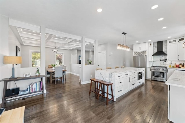 2 Rose Ann Ct, Seekonk, MA 02771 - kitchen with high end appliances, wall chimney exhaust hood, coffered ceiling, recessed lighting, and tasteful backsplash
