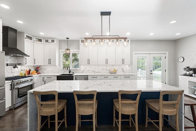 2 Rose Ann Ct, Seekonk, MA 02771 - kitchen featuring wall chimney range hood, appliances with stainless steel finishes, plenty of natural light, tasteful backsplash, and recessed lighting